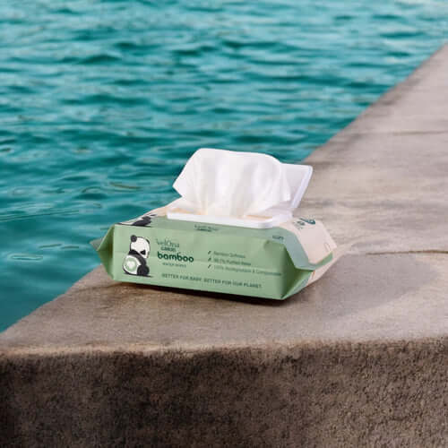 Cuddlies bamboo water wipe open next to a pool