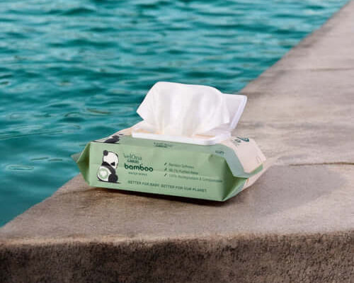 Cuddlies bamboo water wipe open next to a pool