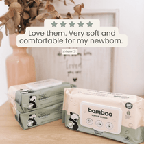 Bamboo water wipes packaging with a five-star rating and customer review on a wooden surface.